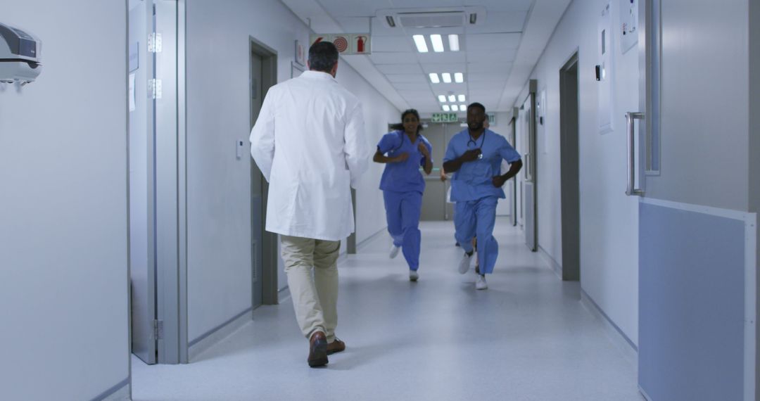 Emergency medical team running in hospital corridor - Free Images, Stock Photos and Pictures on Pikwizard.com