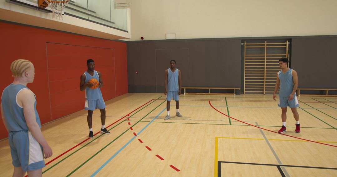 Diverse Basketball Team Practicing Passing in Gymnaisum