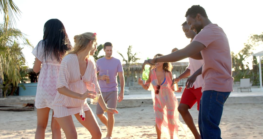 Group of Friends Dancing on Beach - Free Images, Stock Photos and Pictures on Pikwizard.com