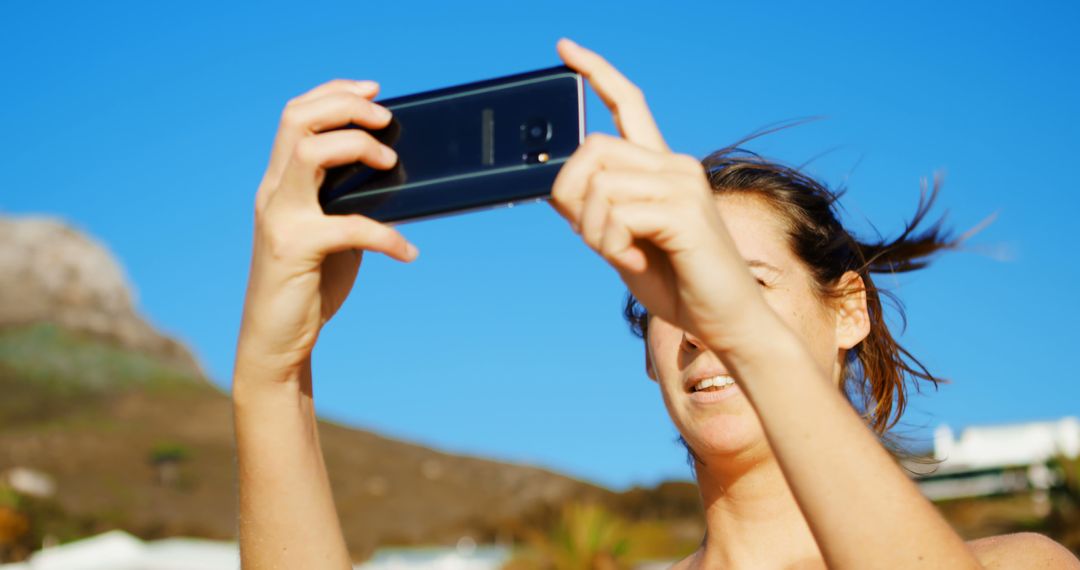 Young Woman Taking Selfie Outdoors on Sunny Day - Free Images, Stock Photos and Pictures on Pikwizard.com