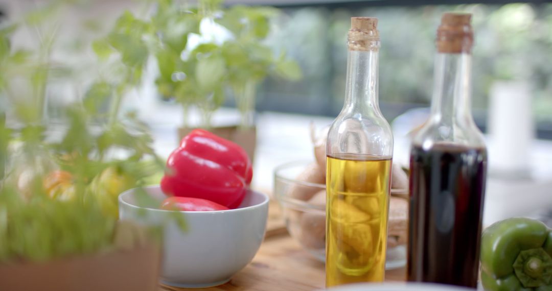 Modern Kitchen Counter with Olive Oil, Vinegar and Fresh Veggies - Free Images, Stock Photos and Pictures on Pikwizard.com