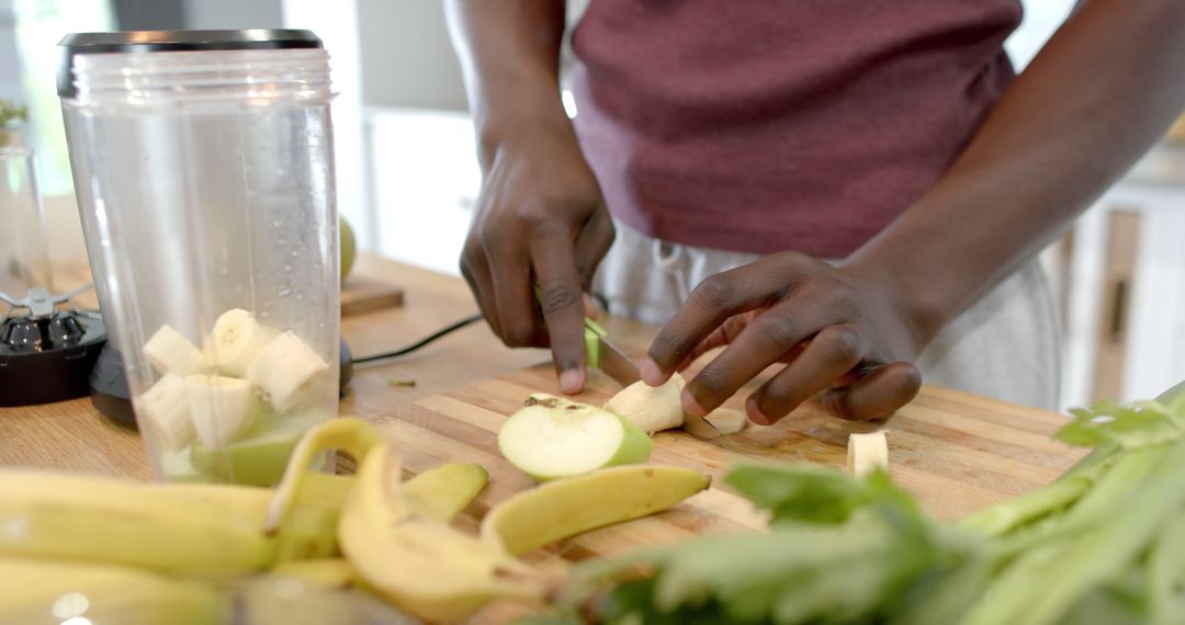 Man Prepares Healthy Smoothie in Home Kitchen