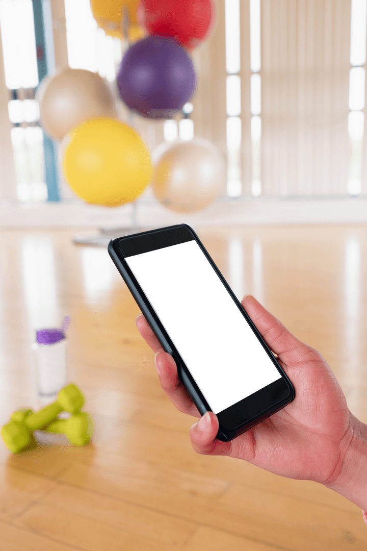 Transparent Phone in Gym Setting with Exercise Equipment