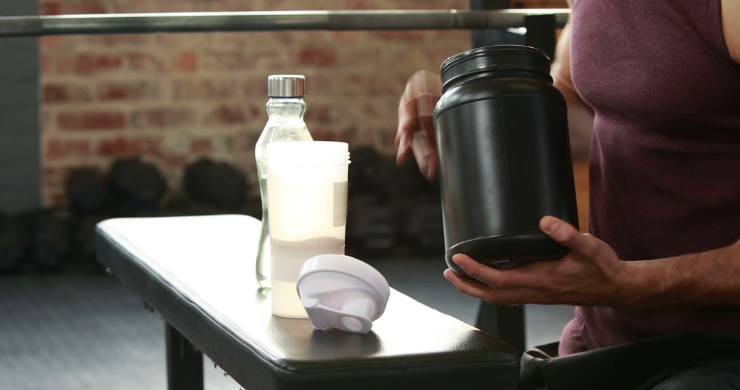 Man Preparing Protein Shake After Workout on Bench - Free Images, Stock Photos and Pictures on Pikwizard.com