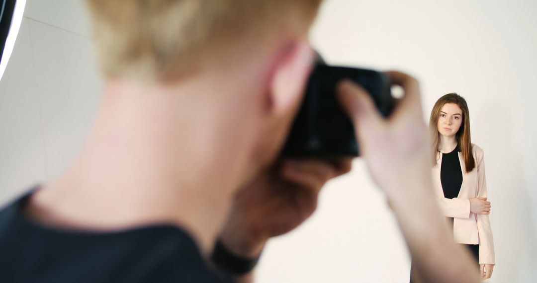 Photographer Takes Portrait of Young Woman in Studio Setting - Free Images, Stock Photos and Pictures on Pikwizard.com