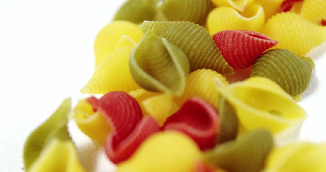 Multicolored Shell Pasta Against White Background - Free Images, Stock Photos and Pictures on Pikwizard.com