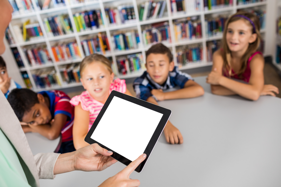 Teacher Showing Tablet to Engaged Students in Library for Digital Lesson - Download Free Stock Images Pikwizard.com