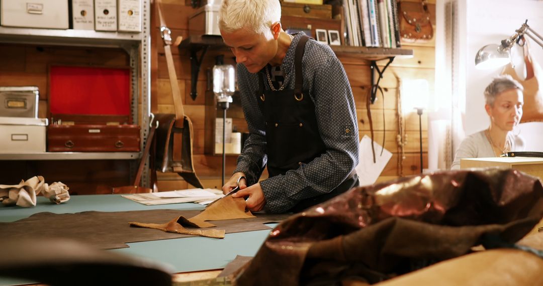 Craftswoman Cutting Leather for Handmade Projects in Cozy Workshop