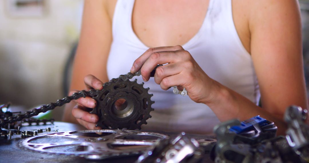 Close-Up View of Mechanic Fixing Bicycle Chain Gear - Free Images, Stock Photos and Pictures on Pikwizard.com