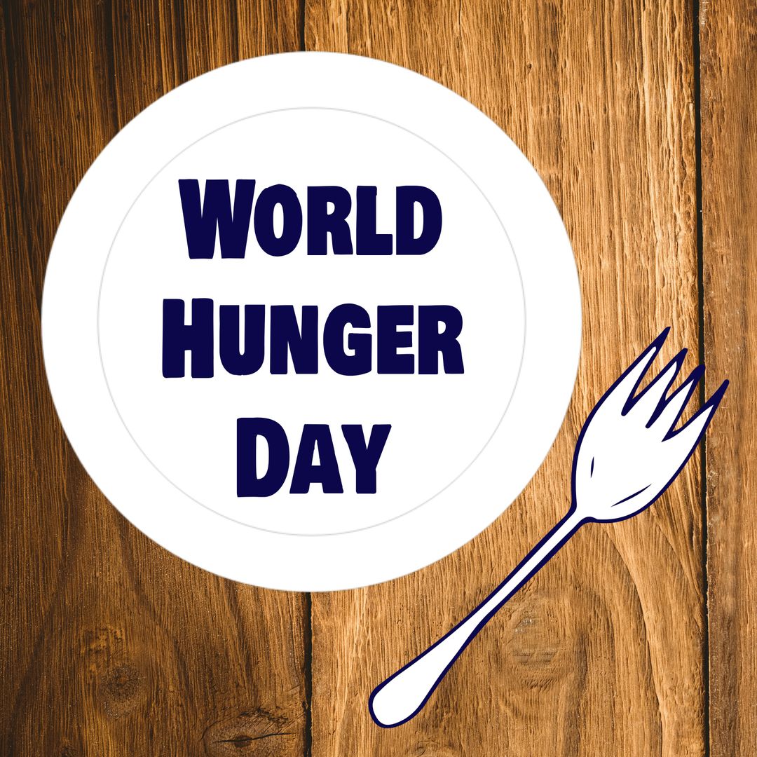 World Hunger Day Plate and Fork on Wooden Table