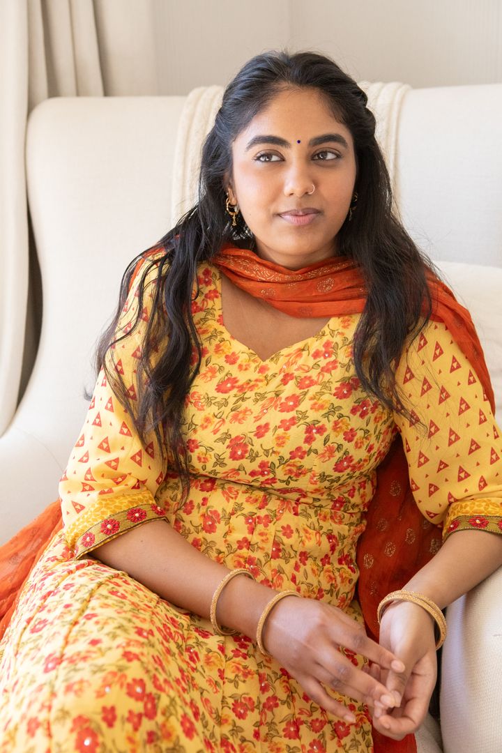 Elegant Indian Woman in Traditional Attire Relaxing at Home