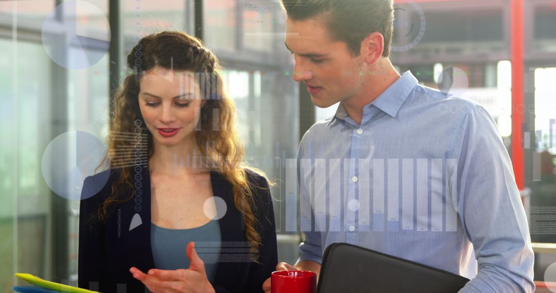Chef Presenting Recipe Concept to Assistant Using Tablet