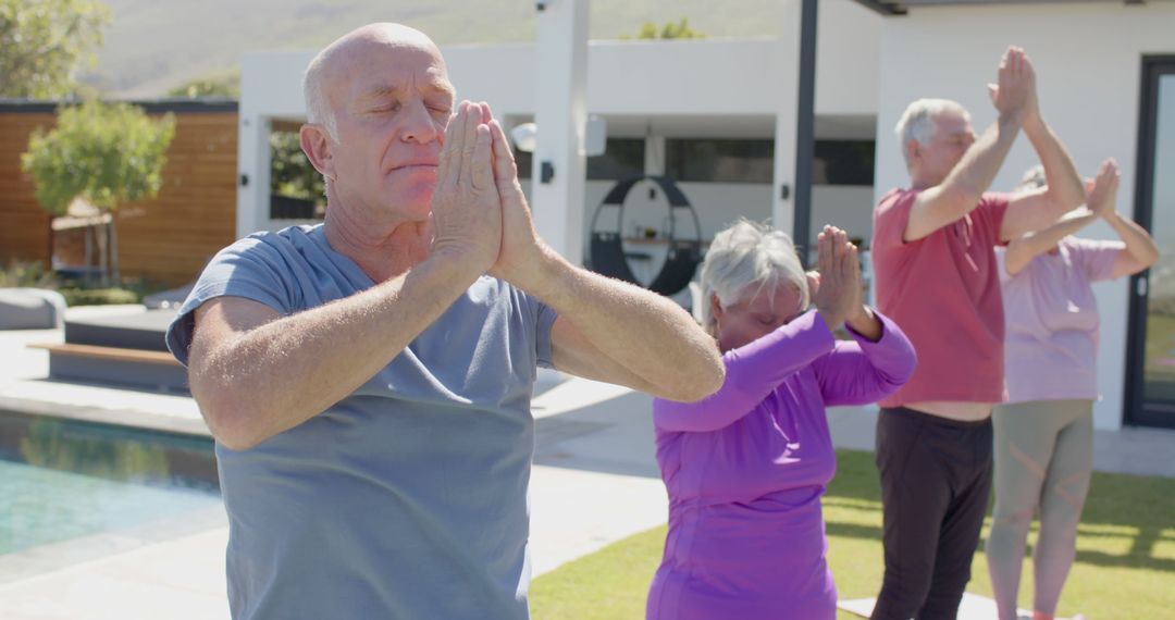 Senior Group Practicing Outdoor Yoga by Pool in Sunshine - Free Images, Stock Photos and Pictures on Pikwizard.com