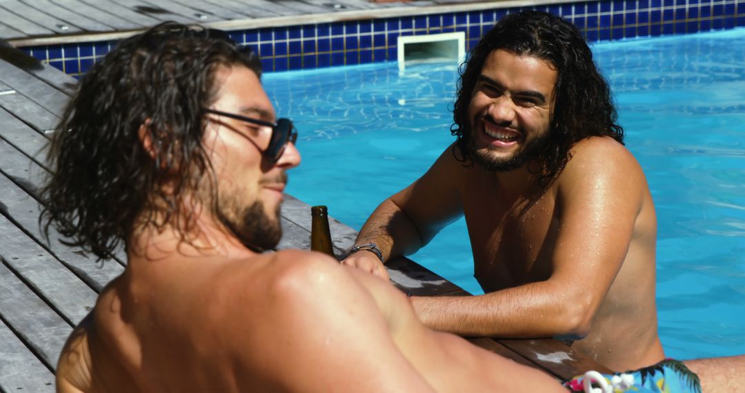 Two Friends Relaxing and Smiling by Pool - Free Images, Stock Photos and Pictures on Pikwizard.com