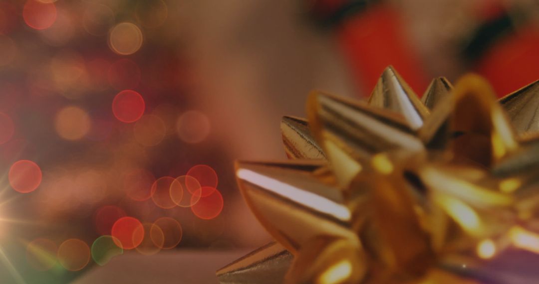 Festive Gold Bow and Red Christmas Lights Bokeh