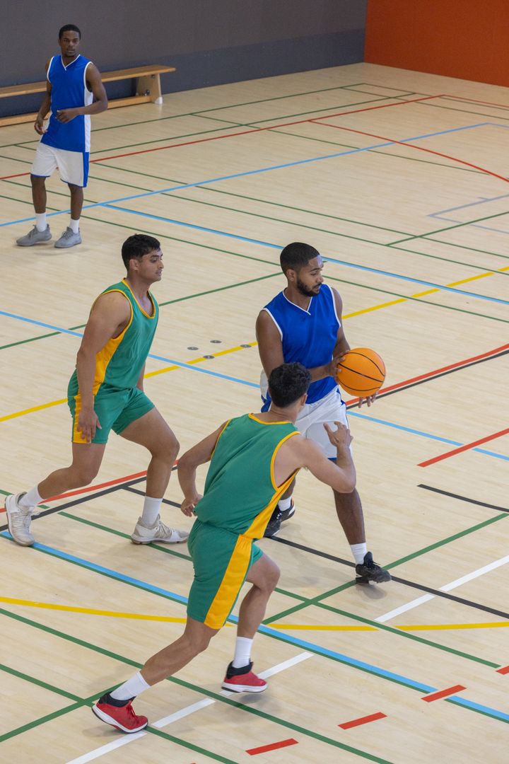 Intense Basketball Game on Indoor Court with Active Participants