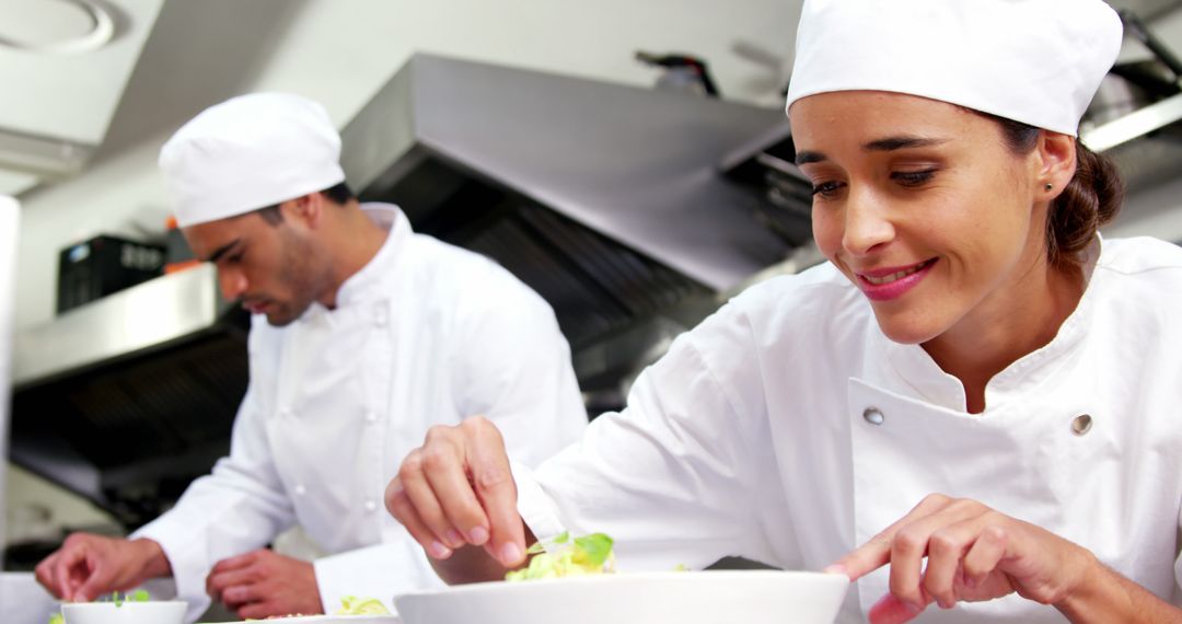 Two Chefs Preparing Dishes in Professional Kitchen - Free Images, Stock Photos and Pictures on Pikwizard.com