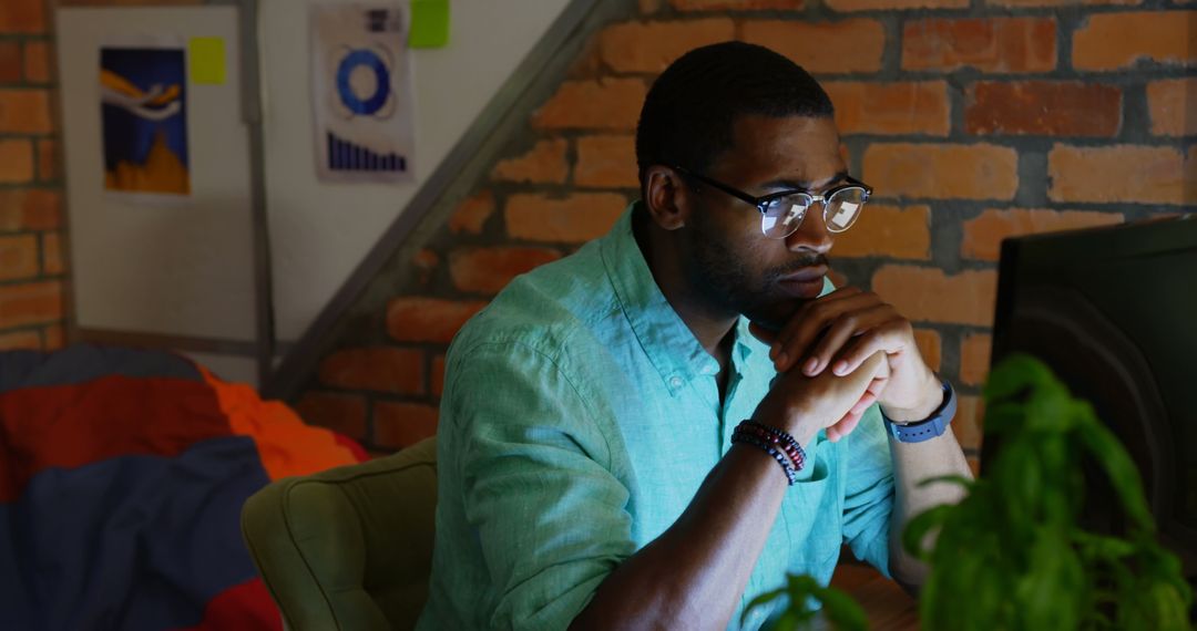 Focused Businessman Analyzing Data on Computer in Stylish Office