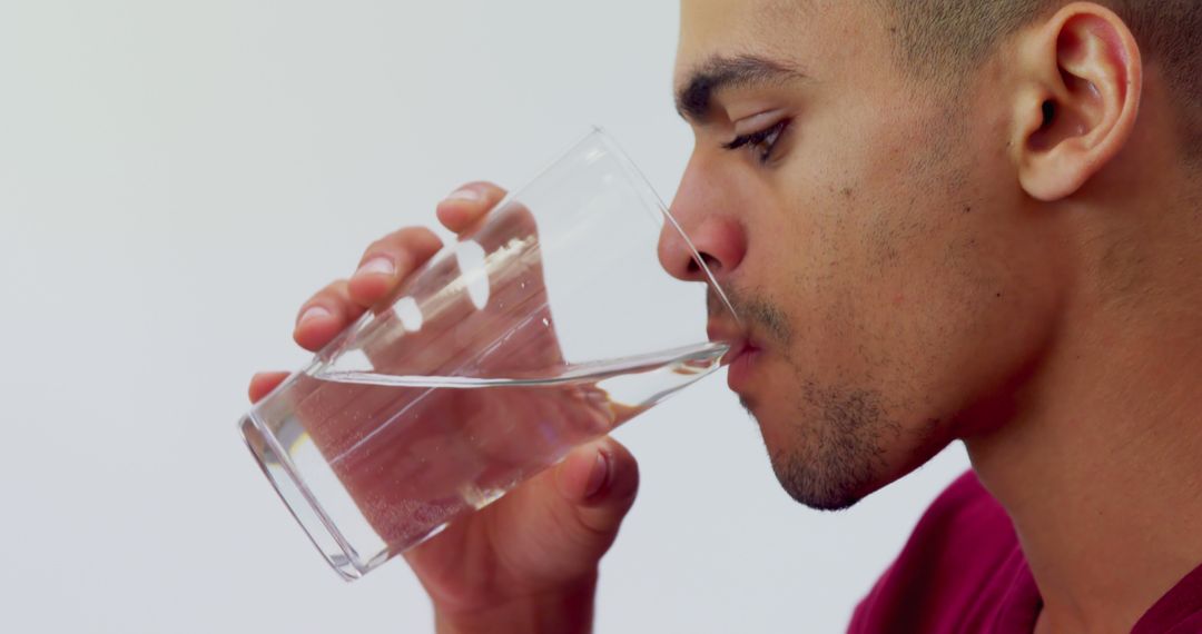 Man Drinking Water from Glass - Free Images, Stock Photos and Pictures on Pikwizard.com