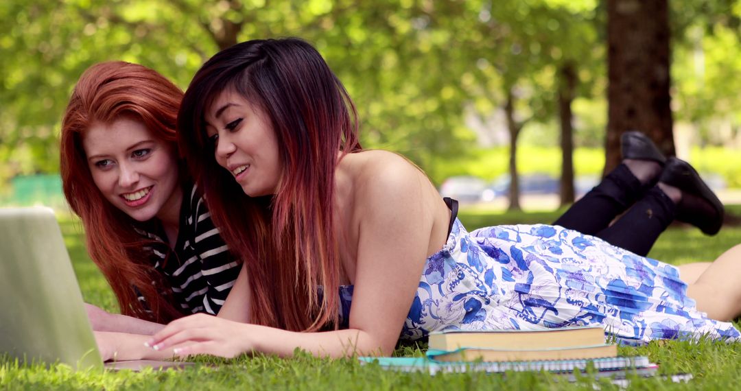 Two Friends Studying Together Outdoors on Laptop - Free Images, Stock Photos and Pictures on Pikwizard.com