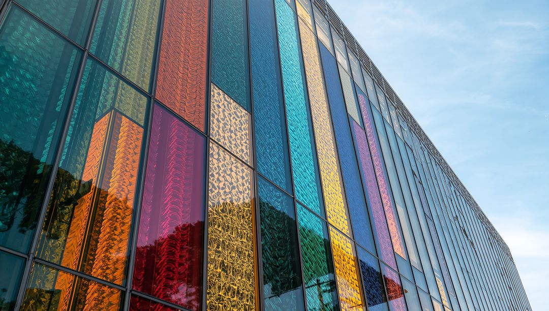 Modern Architectural Facade with Multicolored Glass Panels