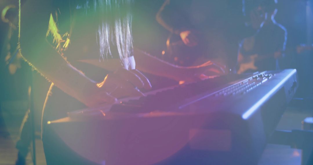 Live Stage Performance by Keyboardist Under Concert Lights