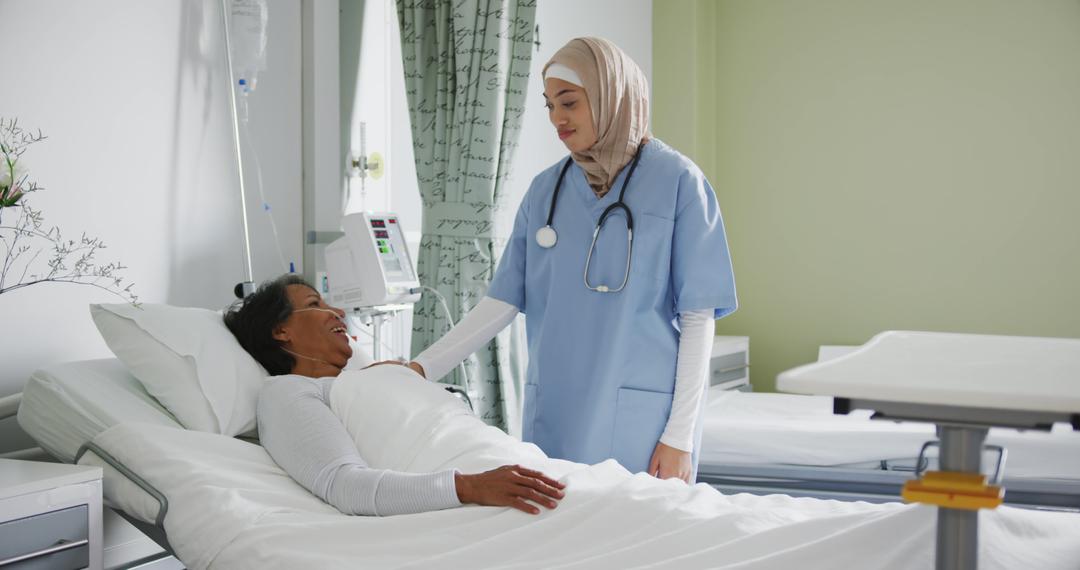 Compassionate Muslim Nurse Cares for Hospitalized Patient - Free Images, Stock Photos and Pictures on Pikwizard.com