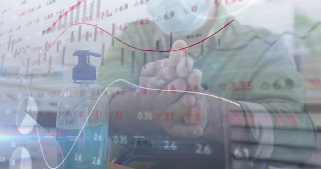 Disinfecting Hands in Office Amidst Financial Data Overlay