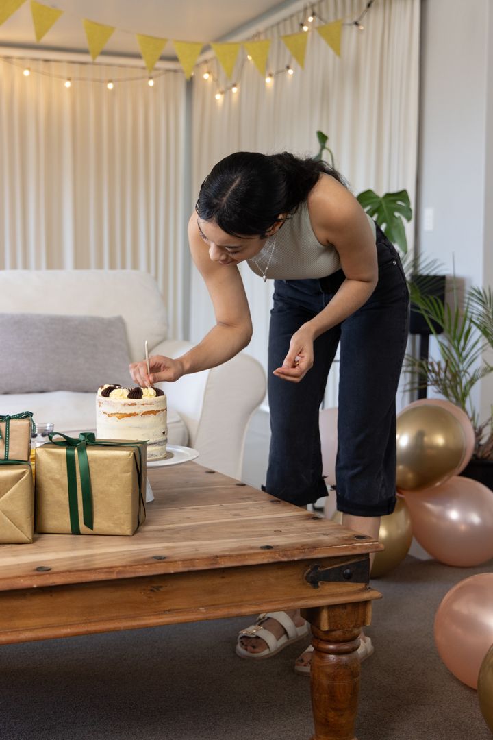 Celebration Preparation Indoors With Thoughtful Cake Decoration