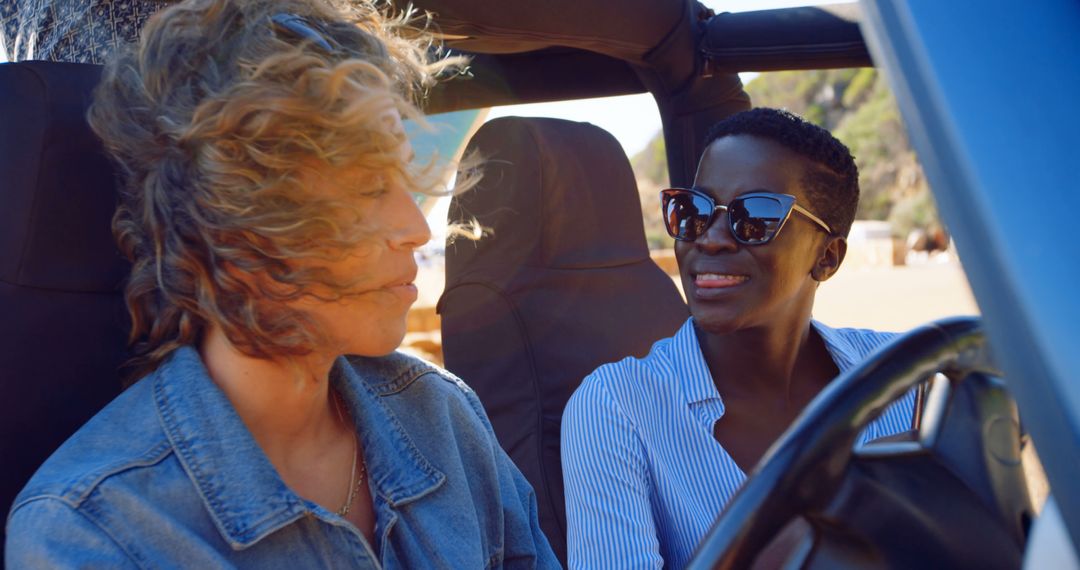 Two Women Enjoying a Scenic Road Trip in Convertible - Free Images, Stock Photos and Pictures on Pikwizard.com