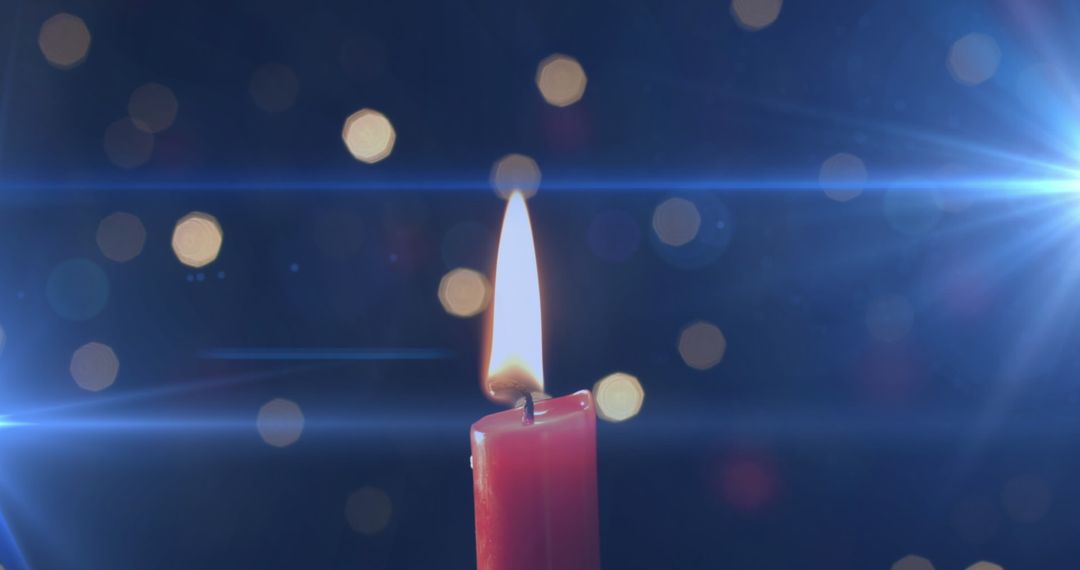 Lit Candle with Flickering Light Bokeh for Remembrance and Tradition