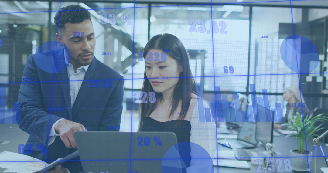 Diverse Team Analyzing Digital Graphs in Modern Office