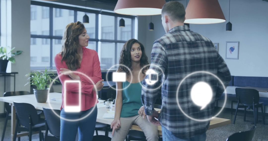 Digital Icons Overlaying Diverse Team in Collaborative Office
