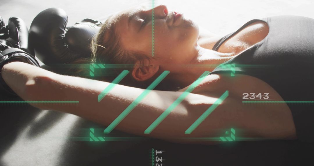 Exhausted Female Boxer Resting After Intense Workout with Futuristic HUD Overlay