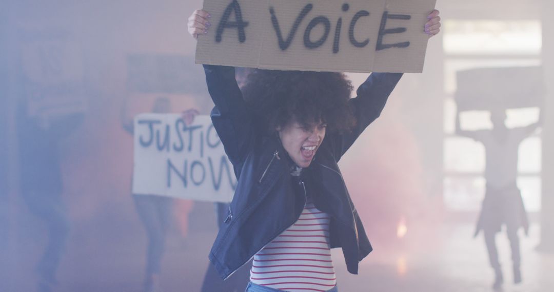 Passionate Activist Holding Sign During Protest - Free Images, Stock Photos and Pictures on Pikwizard.com