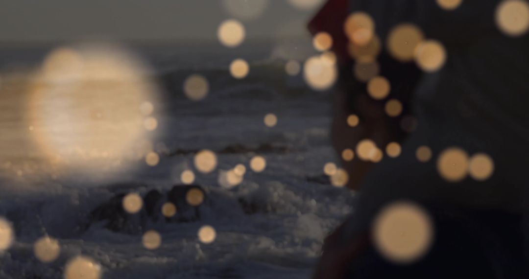Woman Enveloped in Tranquil Ocean Waves and Gentle Bokeh Lights
