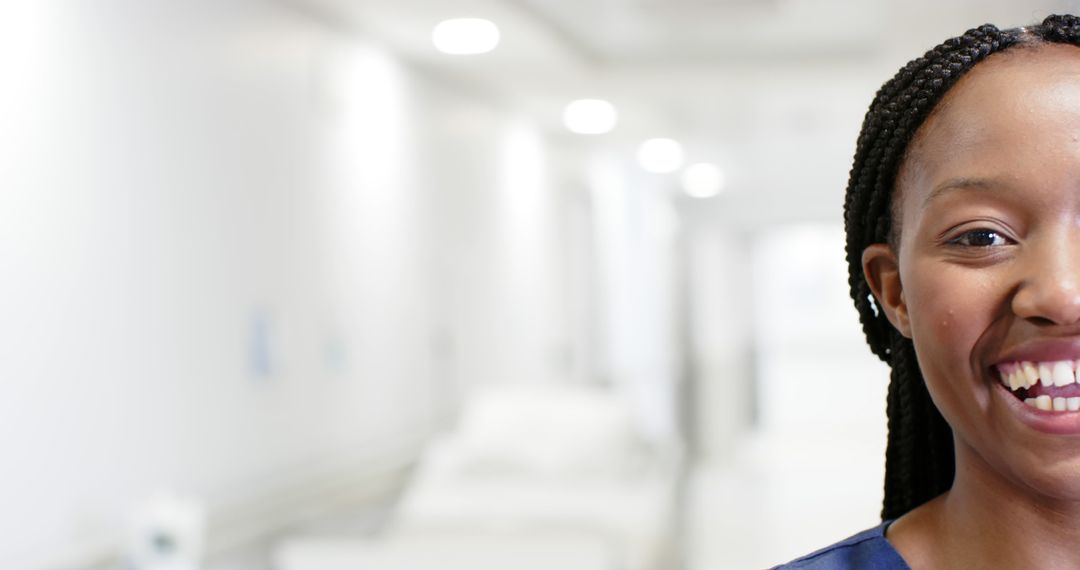 Smiling Nurse in Modern Hospital Corridor - Free Images, Stock Photos and Pictures on Pikwizard.com