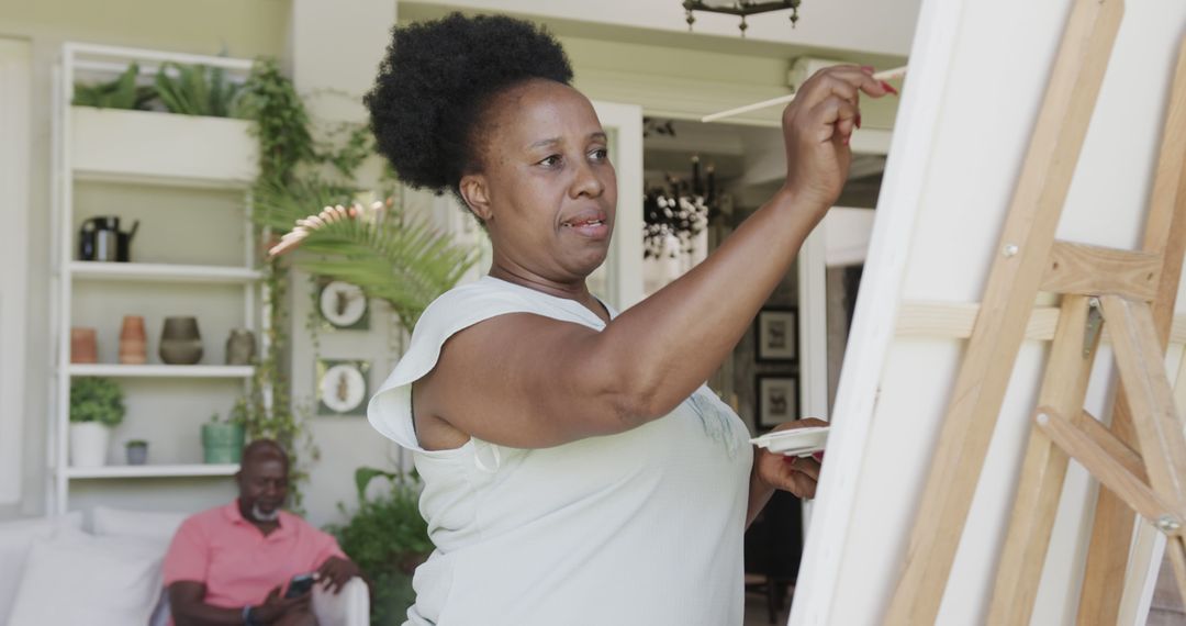 African American Woman Painting at Home During Leisure Time - Free Images, Stock Photos and Pictures on Pikwizard.com