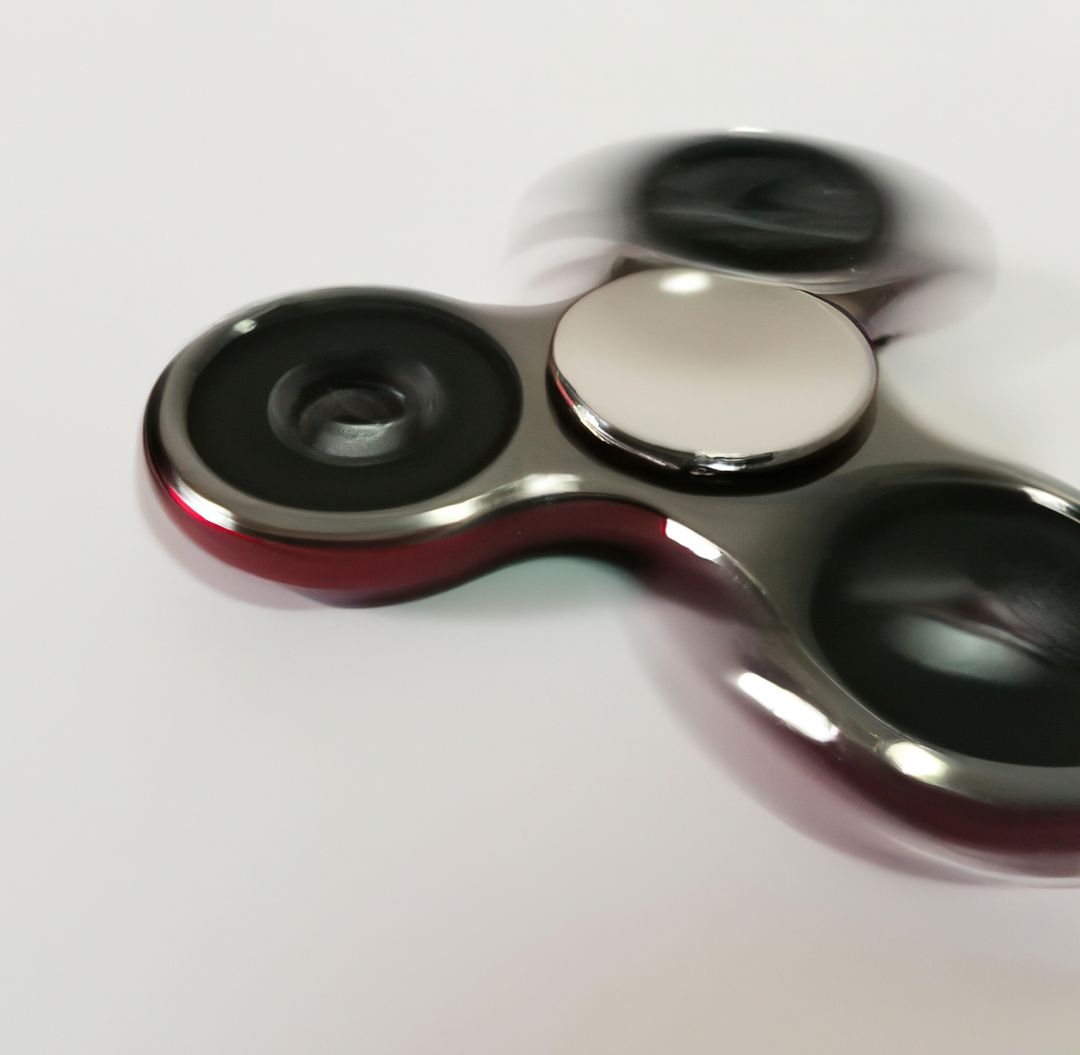 Image of close up of red fidget spinner on white background - Free Images, Stock Photos and Pictures on Pikwizard.com