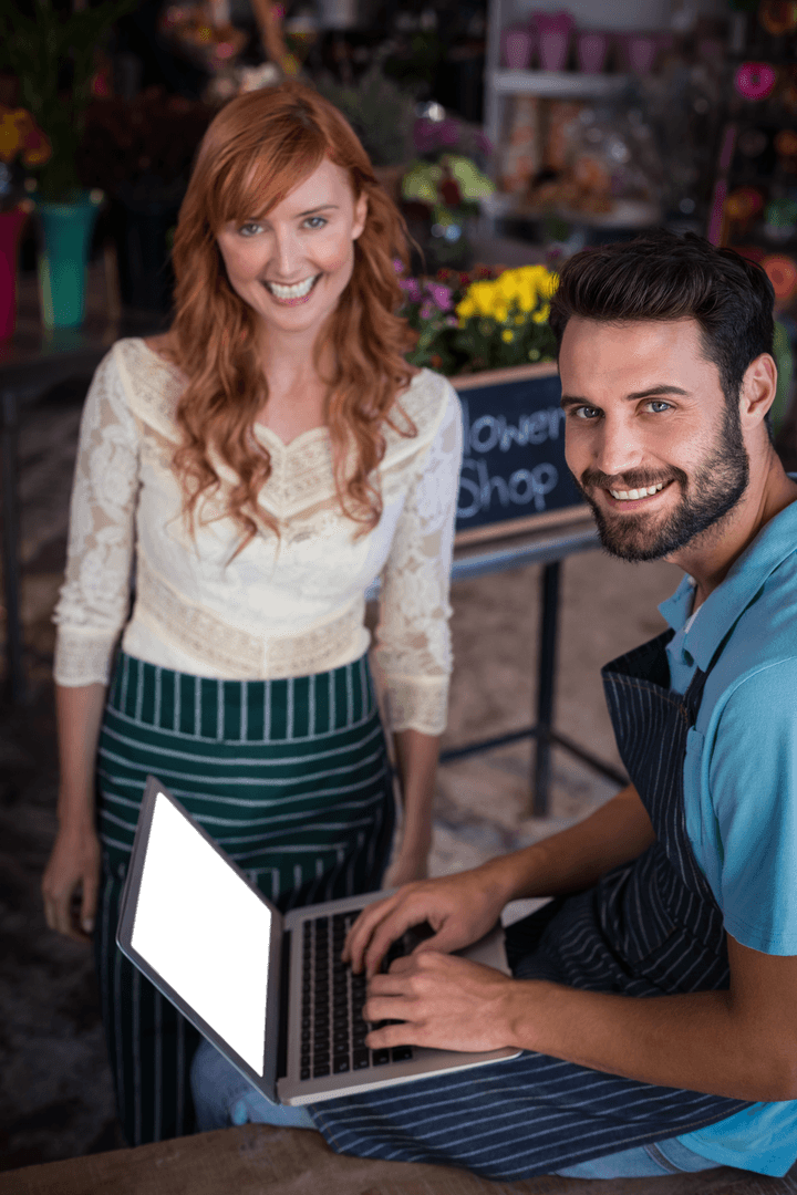 Transparent Smiling Couple Using Laptop in Flower Shop