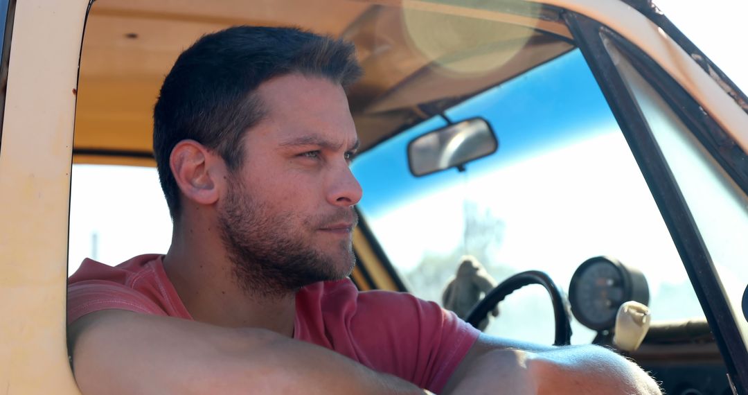 Man Enjoying an Open Road Adventure in Classic Car
