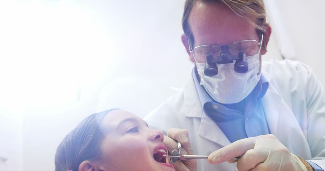 Dentist Treating Child Patient in Clinic - Free Images, Stock Photos and Pictures on Pikwizard.com