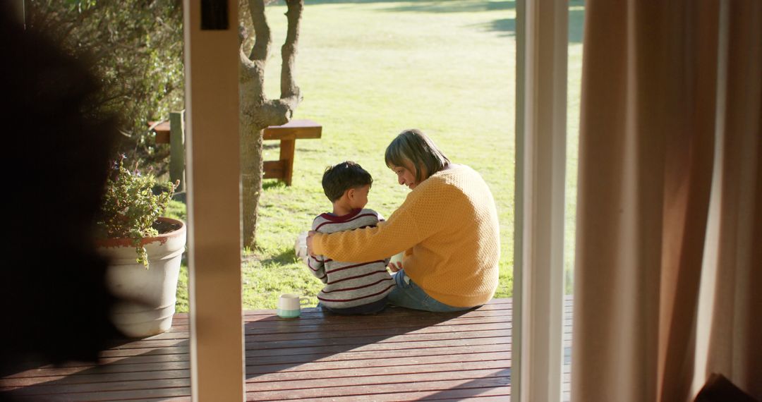 Parent and Child Bonding Outdoors on Wooden Deck - Free Images, Stock Photos and Pictures on Pikwizard.com