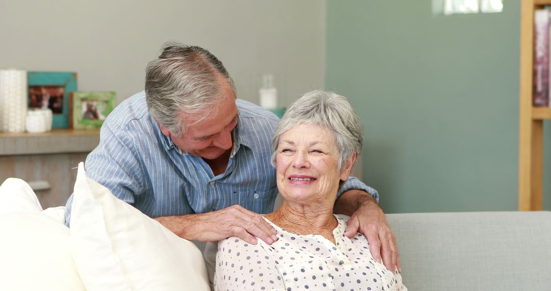 Elderly Couple Enjoying Time Together on Couch - Free Images, Stock Photos and Pictures on Pikwizard.com