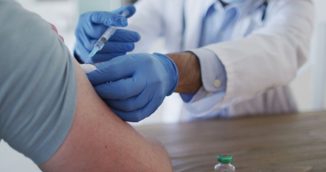 Doctor Administering Vaccine Injection to Patient's Arm - Free Images, Stock Photos and Pictures on Pikwizard.com