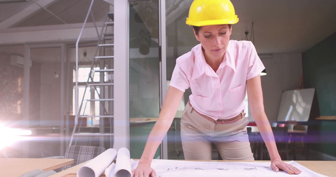 Female Engineer Reviewing Blueprints with Creative Light Effects