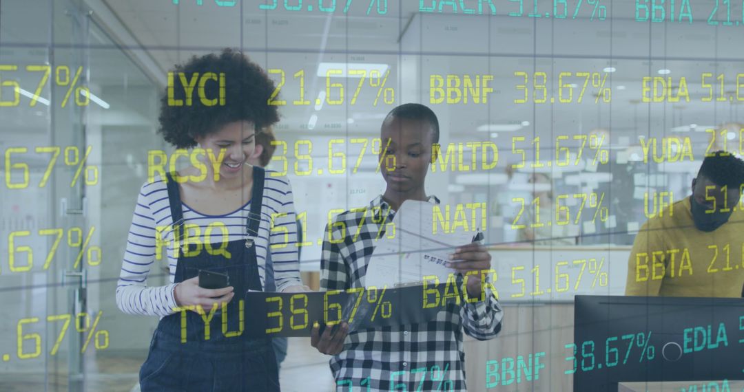 Diverse Colleagues Analyzing Digital Financial Data in Modern Office