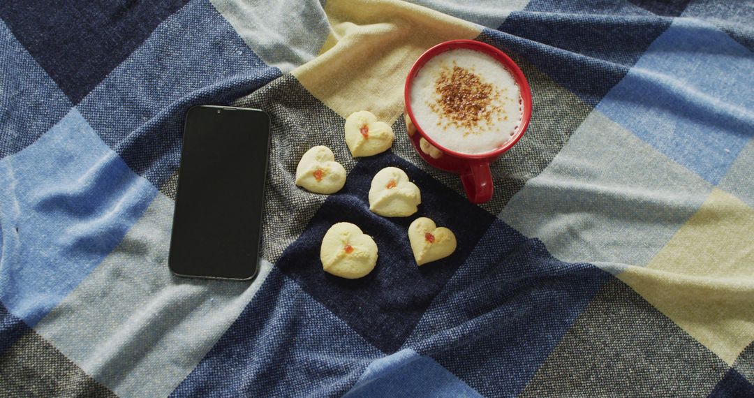 Cozy Breakfast Scene with Coffee, Heart-shaped Cookies and Smartphone - Free Images, Stock Photos and Pictures on Pikwizard.com