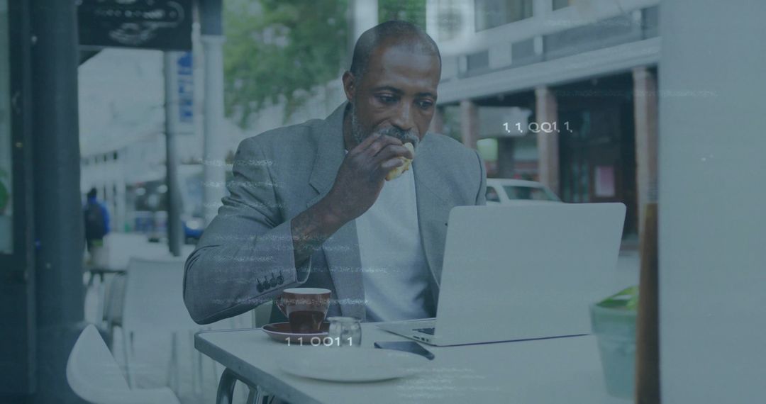 Professional Man Performing Telework While Enjoying Lunch at Sidewalk Cafe