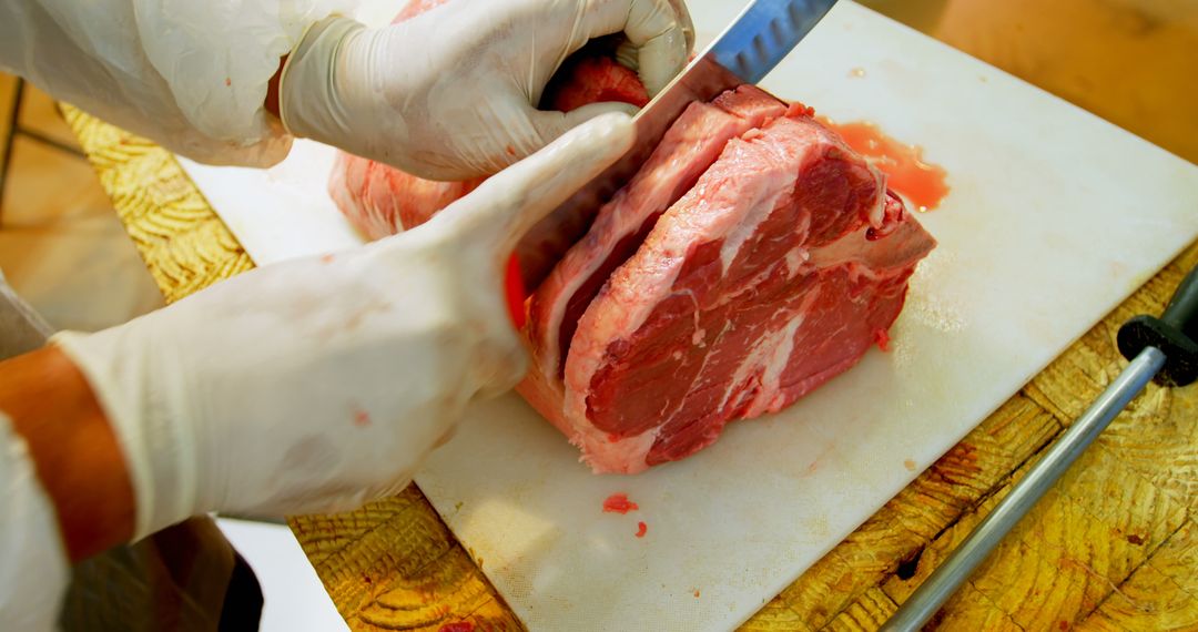 Butcher Cutting Large Steak on Wooden Cutting Board - Free Images, Stock Photos and Pictures on Pikwizard.com